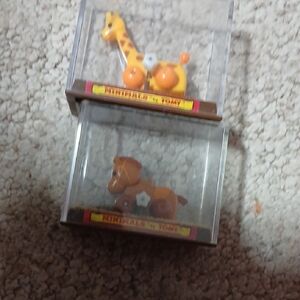 Miniature Giraffe and Horse Figurines in Display Cases